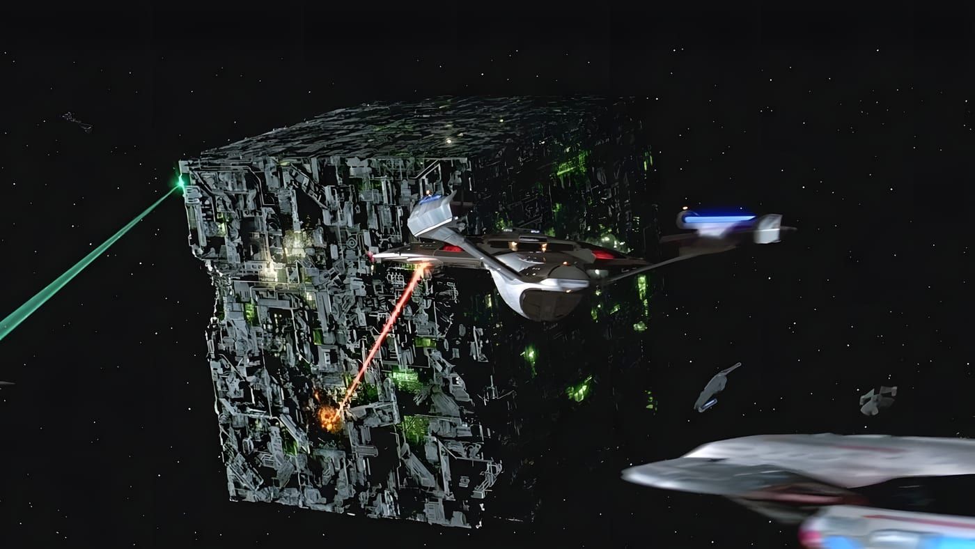 A Borg cube under heavy fire from Federation starships in deep space, phaser beams and green Borg energy visible against starfield.