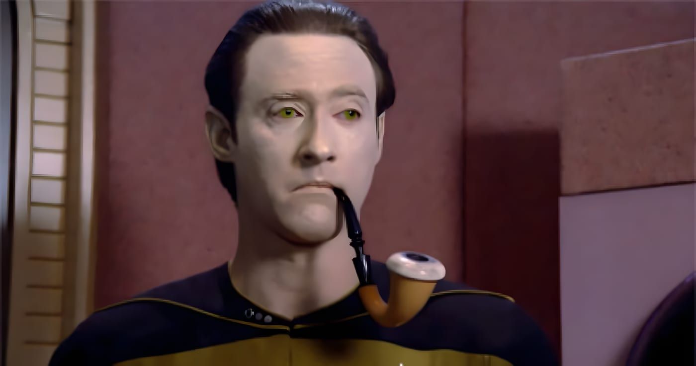 Data holding a pipe while participating in a Sherlock Holmes holodeck program.