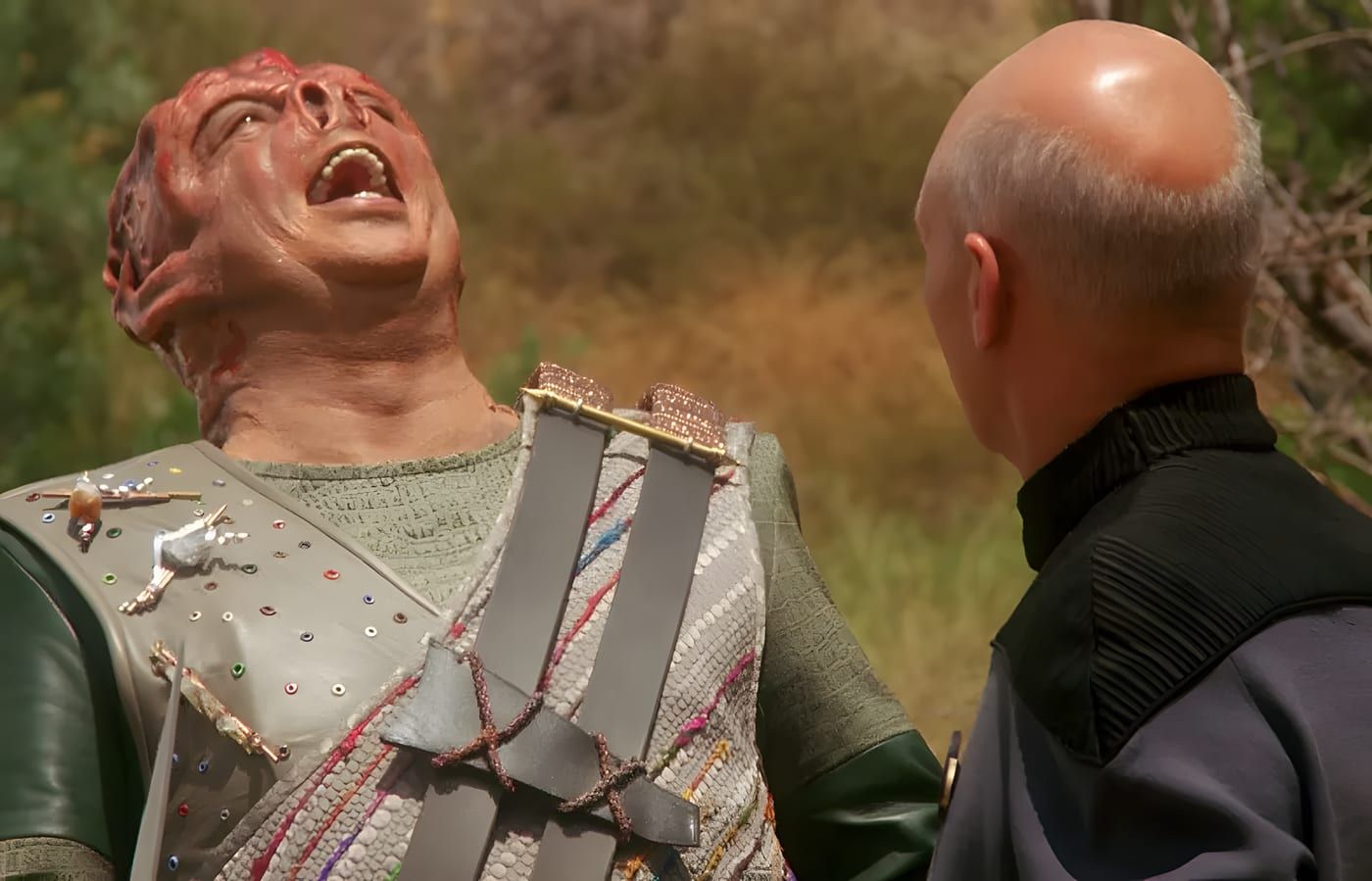 Dathon laughing during his encounter with Jean-Luc Picard.