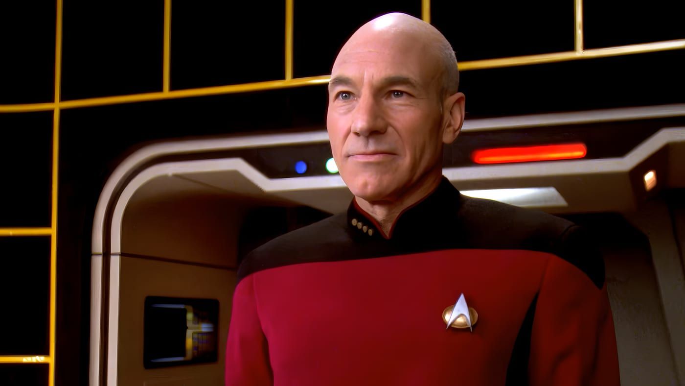 Captain Jean-Luc Picard in Starfleet command red, in a holographic-style portrait.