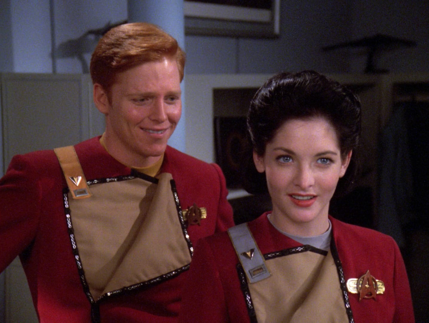 Marta Batanides standing beside Cortan Zweller in Starfleet cadet-era uniforms.