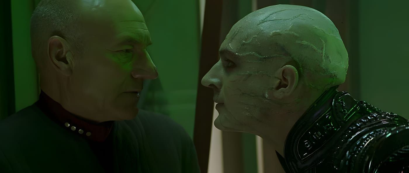 Shinzon and Jean-Luc Picard in the same frame, facing one another in tense proximity.