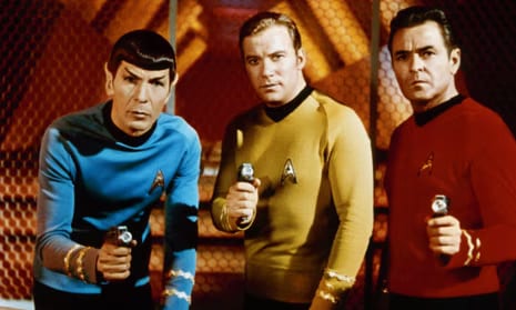 Spock standing with fellow Enterprise officers from the 23rd century.